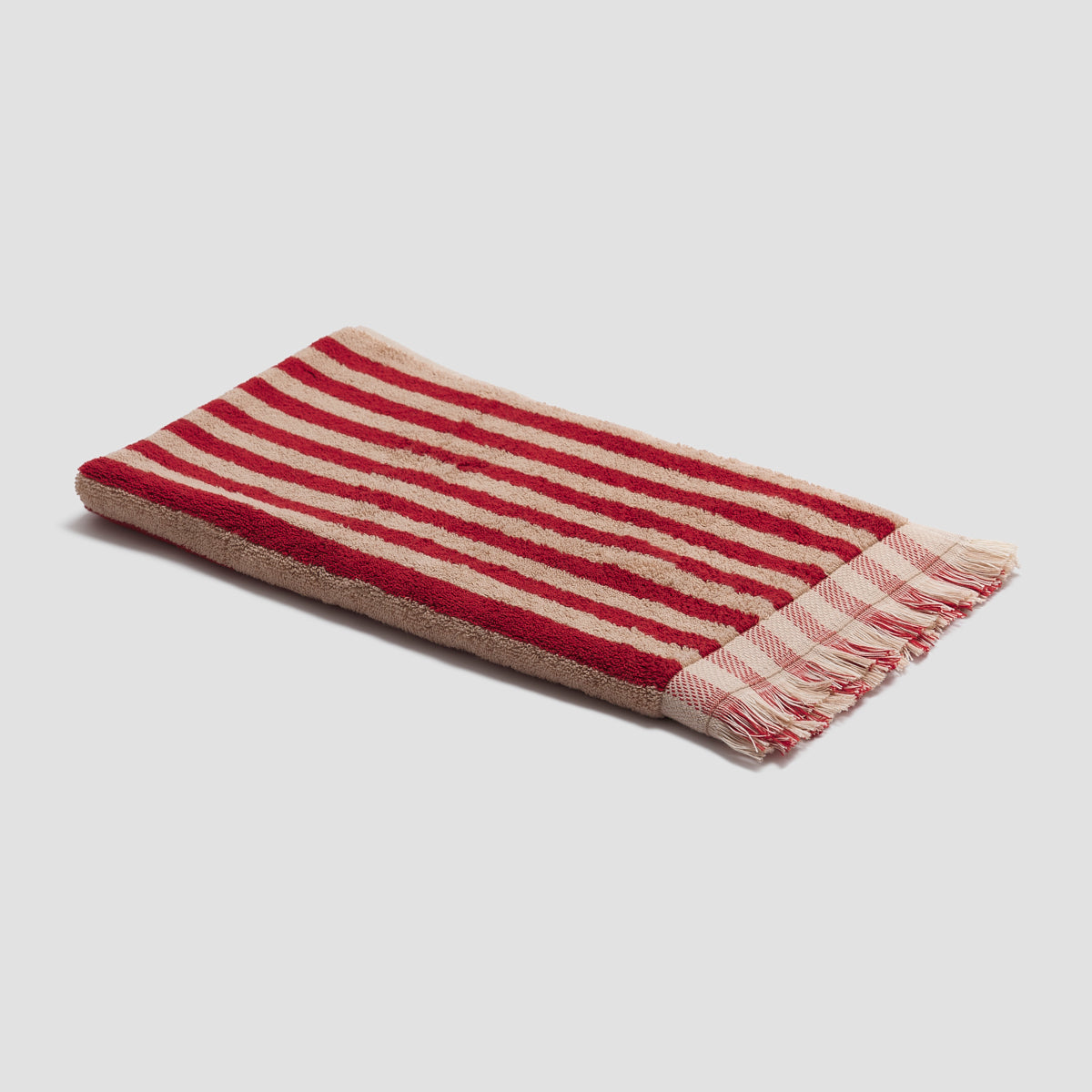 PigletinBed-BathroomCollection-PembrokeStripeCottonHandTowel-SandstoneRed-1_GreyBG_28d21e68-3a19-4c1f-b014-0bbd979ab2df